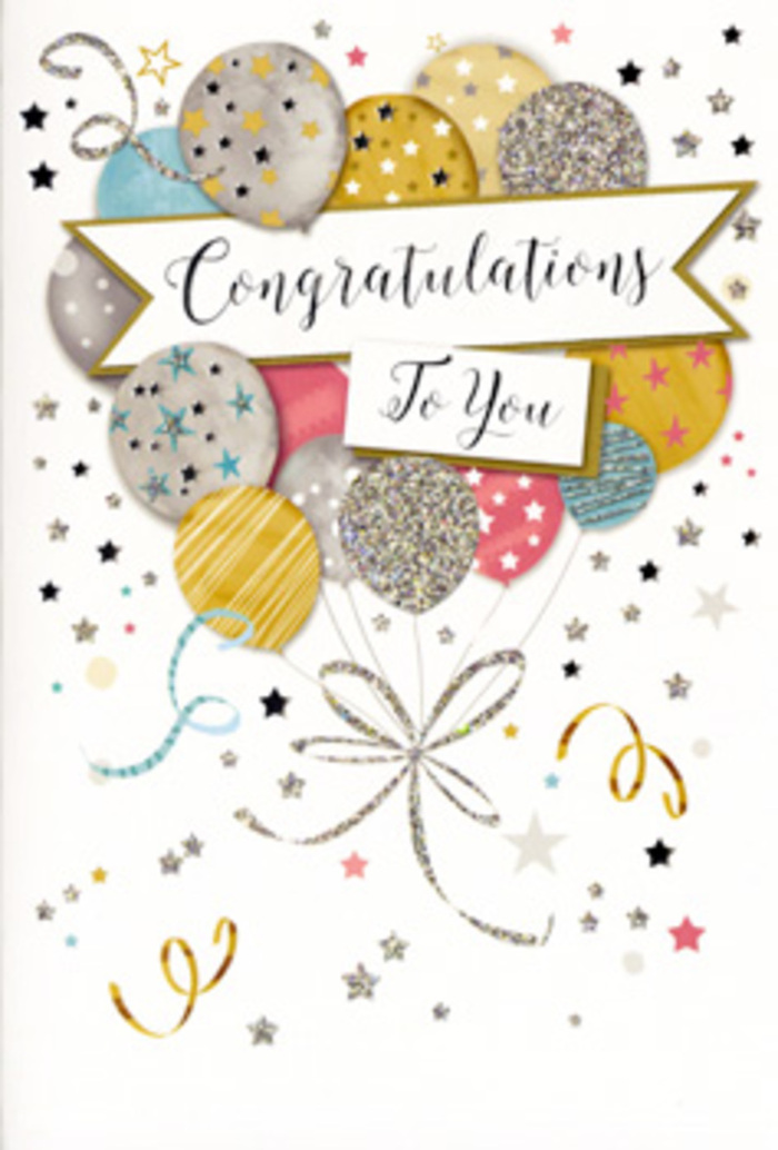 The image shows a refined, portrait-style congratulations card, propped upright as though waiting beside a fresh bouquet in a Palmers Green home. Dominating the design is a cluster of celebratory balloons, gathered like a cheerful bouquet at the centre of the card. The balloons are soft and rounded, printed in gentle hues of champagne gold, muted silver, blush pink, powder blue, and cool grey, each one decorated with distinct metallic details-some with narrow vertical stripes, others with scattered stars or fine speckles that shimmer as they catch the light. Their curling ribbons, drawn in gleaming gold and silver, trail downwards in loose spirals that overlap and intertwine, suggesting the relaxed elegance of a well-tied ribbon on a gift from a local florist near Green Lanes. Surrounding the balloon cluster, tiny metallic stars, dots, and ribbon-like swirls float against a pale, almost creamy background, echoing the atmosphere of a small celebration after work or after school in nearby Broomfield Park. Across the centre, a gently arched banner stretches from side to side, its edges picked out in subtle metallic tones. On this banner, the words Congratulations To You appear in ornate, calligraphic lettering, the letterforms sweeping gracefully, conveying genuine admiration and joy. The card's design is airy and uncluttered, leaving space for each element to breathe while still feeling full of movement and festivity. The finish appears slightly glossy, especially on the foil details, hinting at a tactile contrast between smooth cardstock and raised, glitter-like accents. It feels perfectly suited to mark milestones-a promotion, university acceptance, or retirement-paired with flowers delivered locally across Palmers Green by a trusted neighbourhood florist.
