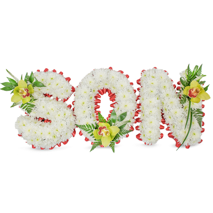 Meticulously assembled by a local Palmers Green florist, this sympathetic floral tribute spells the name SON in bold three-dimensional letters made from hundreds of small white chrysanthemums, each bloom placed to create a uniformly full and cloud-like surface. A continuous border of red ribbon is artfully folded into scalloped loops around every letter, the rich crimson providing a visual heartbeat against the pure white chrysanthemum field. Placed as focal accents are three yellow-green cymbidium orchids, each with a distinctive reddish-brown throat: one nestles into the upper left curve of the S, a second cradles the inner base of the O, and the third adorns the upper right of the N. Surrounding the orchids, generous sprays of green foliage - long lance leaves, glossy stems and feathery fern fronds - add depth, lift and a natural, living quality that softens the structured letters. The composition is photographed on a plain white backdrop so textures and colors read with quiet clarity; the waxy orchid petals contrast with the chrysanthemums' fine, matte petals and the satin sheen of ribbon. Intended as a personalised funeral or memorial tribute, this design balances purity with a strong emotional accent and would be chosen by families seeking an intimate, handcrafted expression of love. Flowers Palmers Green prepares pieces like this for services across Palmers Green, Green Lanes and Winchmore Hill, offering thoughtful local knowledge when arranging delivery to chapels or gravesides.