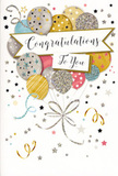This image features a sophisticated congratulations card standing upright, its front artwork capturing the light, buoyant feeling of a celebration unfolding quietly somewhere off Green Lanes in Palmers Green. At the centre floats a charming cluster of balloons, layered so they overlap like petals in a bouquet. The balloons glow in gentle shades of warm gold, soft silver, champagne, sky blue, blush pink, and subtle grey. Their surfaces are adorned with metallic patterns-slender stripes, twinkling stars, and tiny dots-that glisten as if brushed with fine glitter. Slender ribbons in metallic gold and silver trail from each balloon, curling downward and crossing over one another in loose, elegant arcs that almost reach the base of the card. Scattered around this central bouquet, you can see small metallic stars, confetti specks, and swirling lines, suggesting movement and the joyful flutter of a party near Broomfield Park or Palmers Green Triangle. Cutting gracefully through the middle of the design is a softly curved banner, edged with a hint of shimmer. Upon it, the message Congratulations To You is written in flowing, decorative script, the letters sweeping and looping with a warmth that feels personal and heartfelt. The background remains pale and uncluttered, giving the impression of soft daylight and allowing the metallic accents to shine without overwhelming the senses. The card stock looks sturdy yet refined, likely smooth to the touch, with the metallic elements adding a slight texture. Overall, the design radiates happiness, pride, and a polished sense of occasion-an ideal companion to a hand-delivered bouquet to celebrate local achievements in Palmers Green, from exam success to new beginnings.